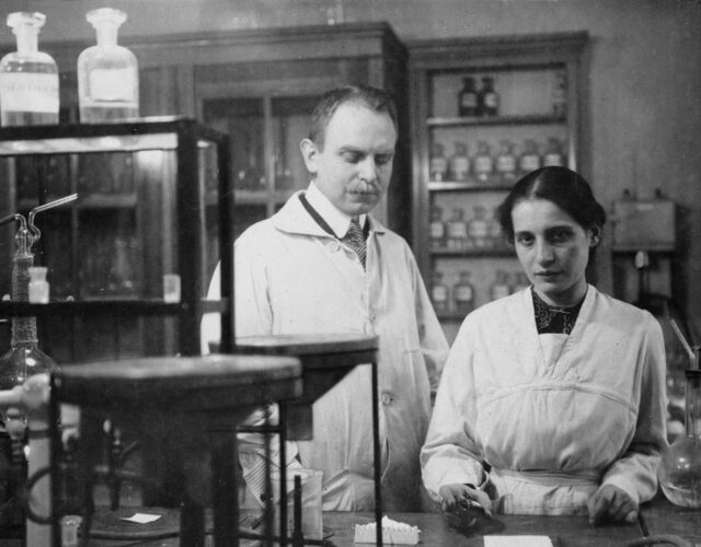 Black and white photo of man and woman in a lab