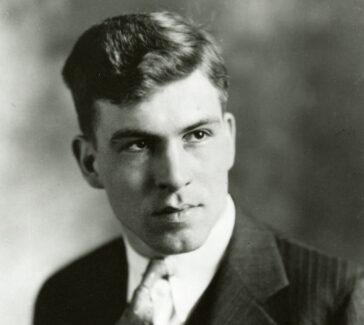 A professional portrait of Donald Othmer as a young man, wearing a suit and tie.