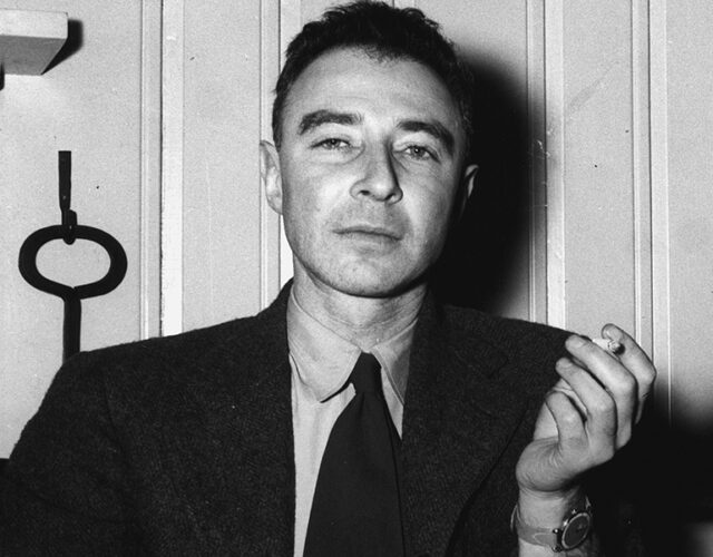 portrait of Robert Oppenheimer sitting down smoking